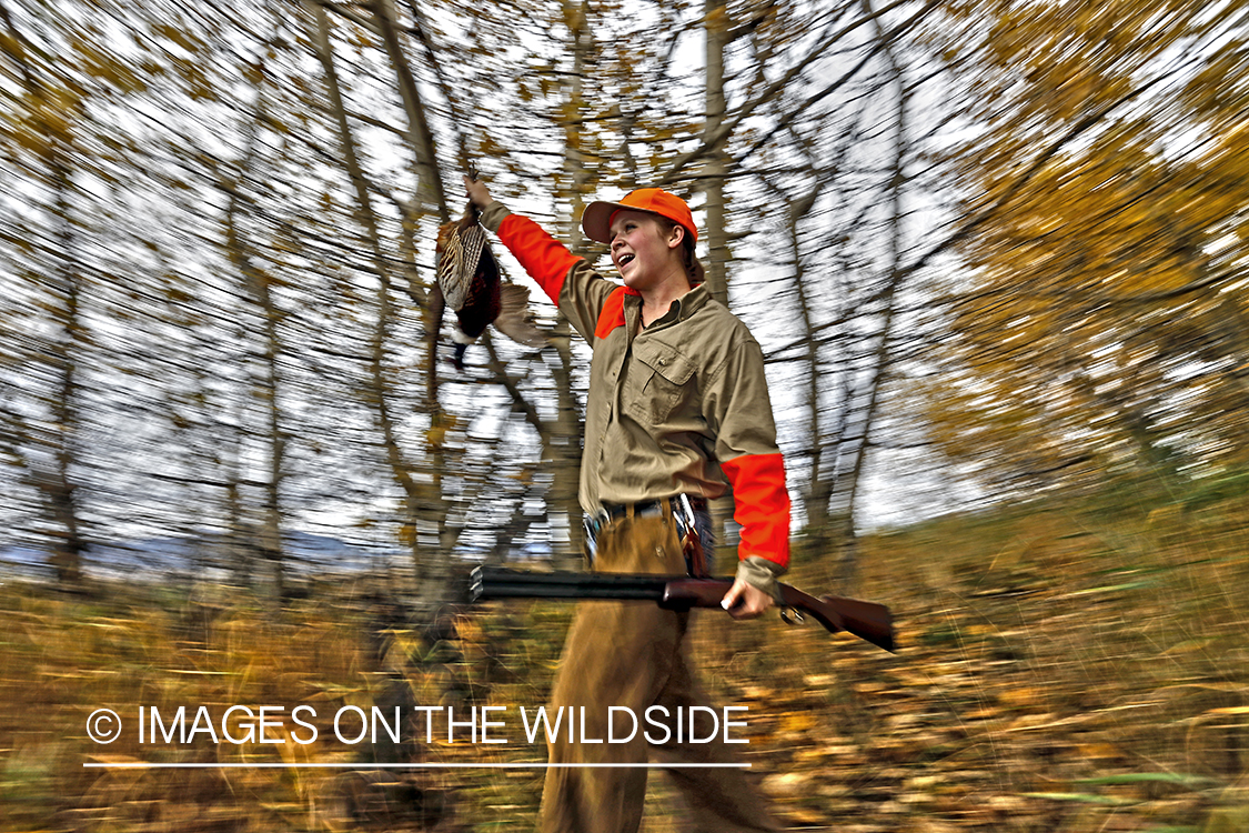 Woman with bagged pheasant.