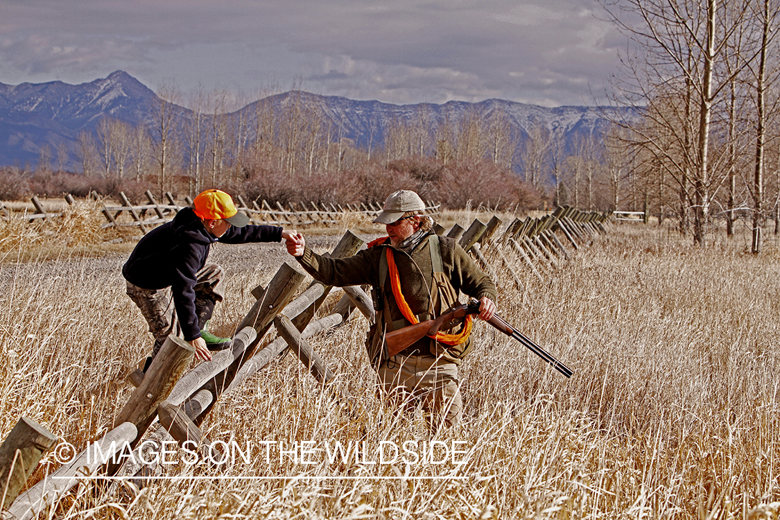 Father and son pheasant hunting. 