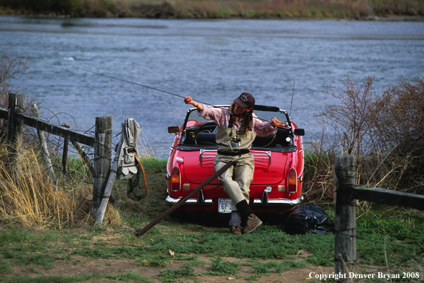 Flyfisherwoman getting ready to fish