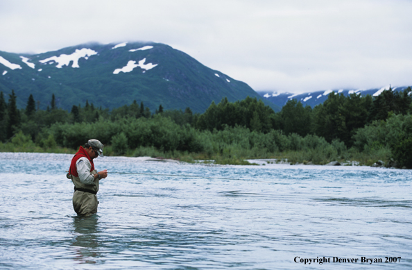 Flyfisherman tying fly