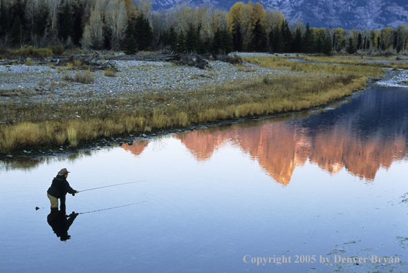 Flyfisherman casting on river.