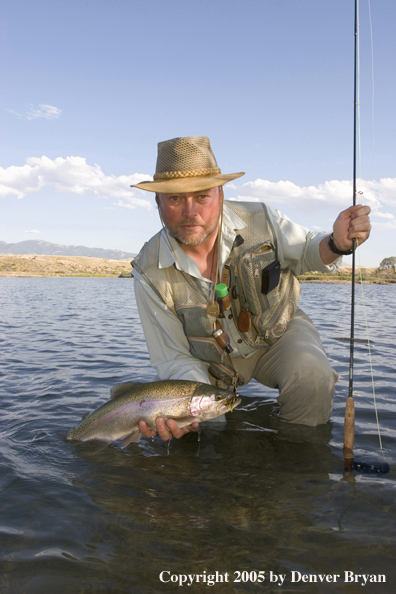 Flyfisherman with Rainbow Trout, Rocky Mountains