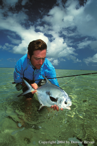 Saltwater flyfisherman holding permit.