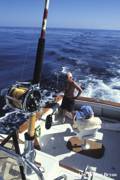 Fisherman on boat with guide