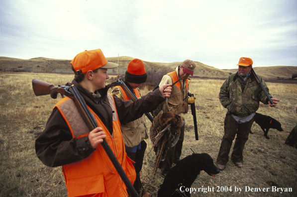 Fathers and sons pheasant hunting.