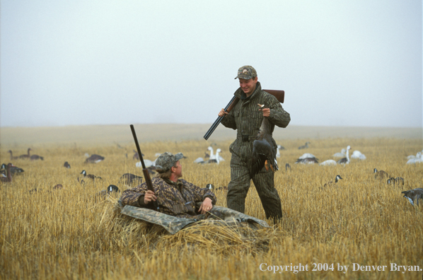 Waterfowl hunters with bagged goose.