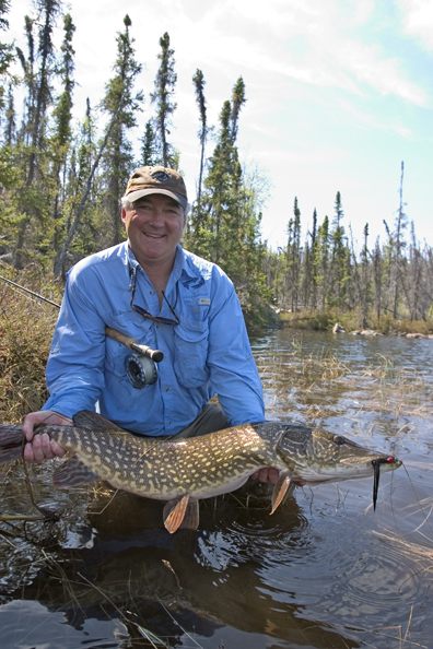 Flyfisherman with Northern pike