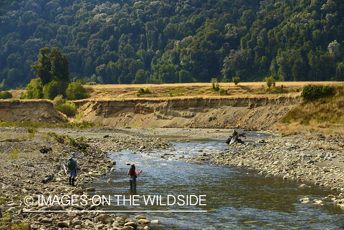 Flyfishermen on river in Chile.