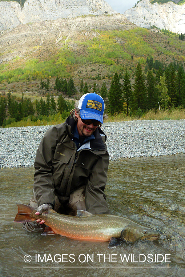 Flyfisherman with bull trout.