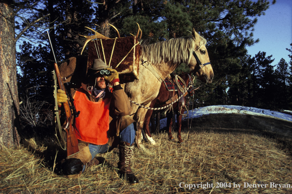 Successful big game hunter glassing.