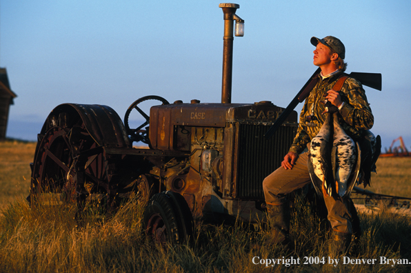 Waterfowl hunter with bagged White-fronted geese.