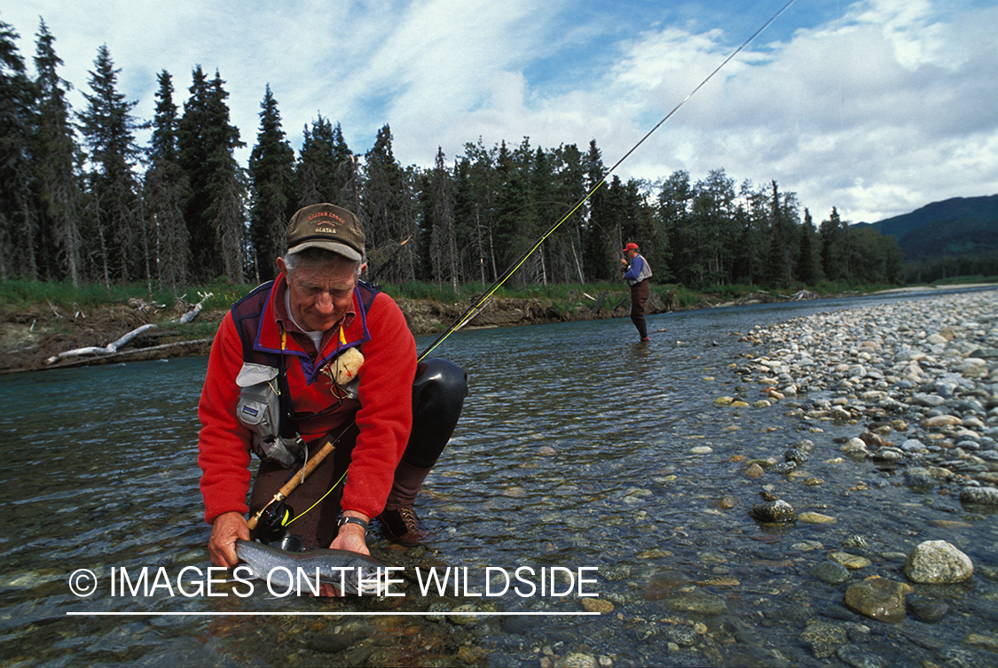 Flyfisherman holding Arctic char.