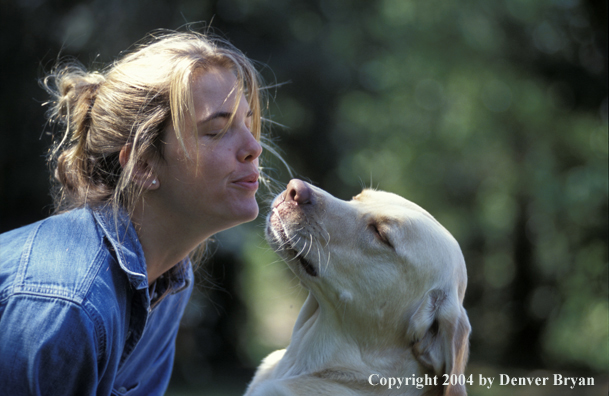 Woman with yellow Labrador Retriever