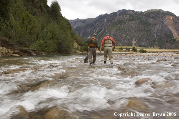 Flyfishermen walking up river.