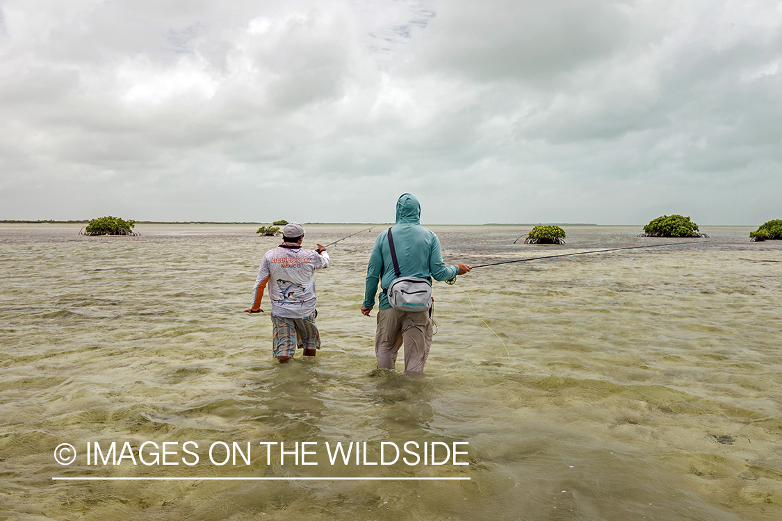 Flyfisherman and guide flyfishing for Bonefish and Permit.