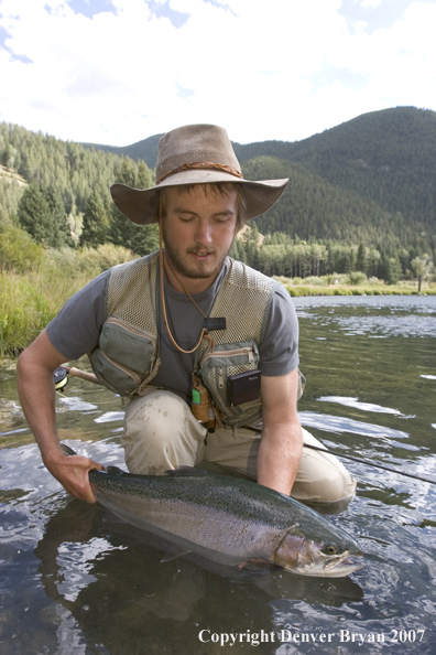 Flyfisherman with Rainbow Trout on Gallatin River, Montana