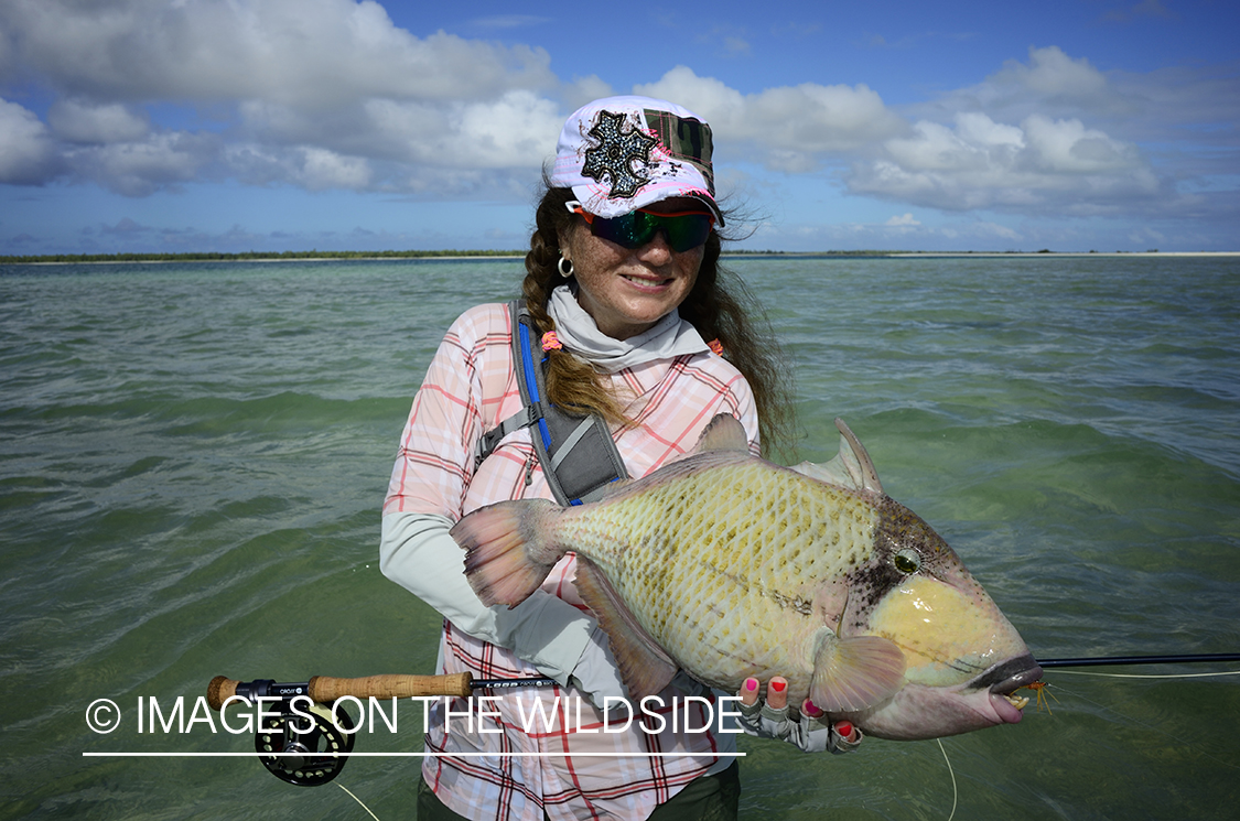 Woman with Peachy Triggerfish.