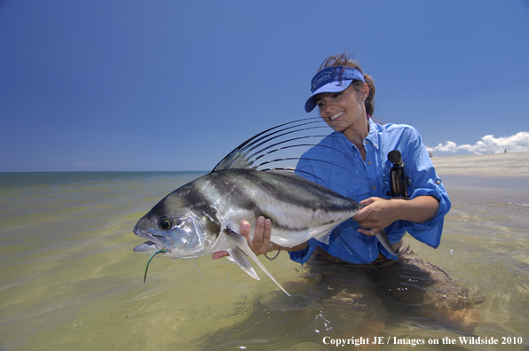 Woman holding nice Roosterfish catch