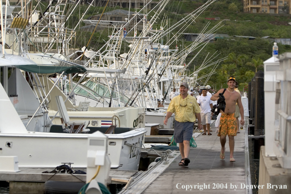 Deep sea fishing charter boats in marina.