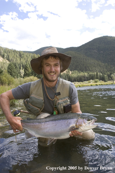 Flyfisherman with Rainbow Trout, Rocky Mountains