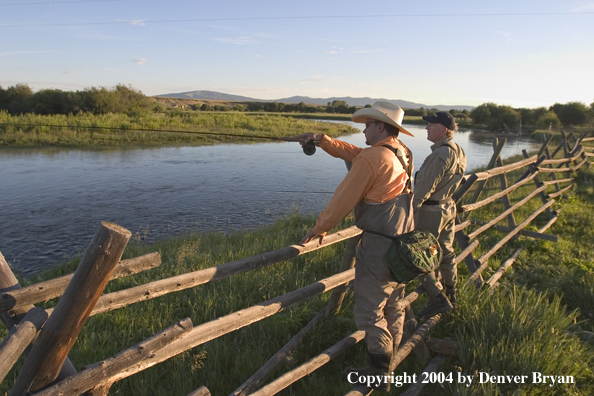 Flyfisherman scouting river.