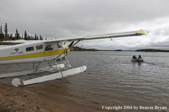 Fishermen setting off to fish from their float plane.  Saskatchewan.