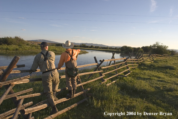 Flyfisherman scouting river.