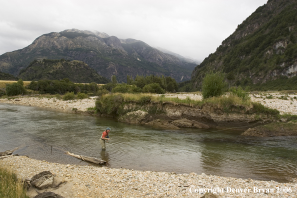 Flyfisherman casting on river.