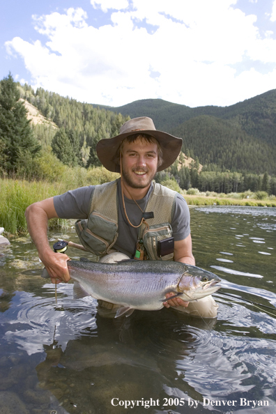 Flyfisherman with Rainbow Trout, Rocky Mountains