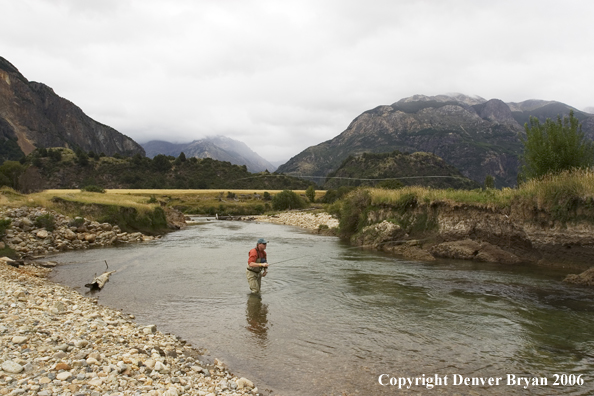 Flyfisherman casting on river.