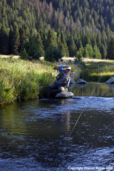 Flyfisherman fighting big fish