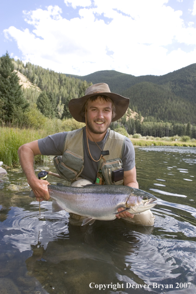 Flyfisherman with Rainbow Trout on Gallatin River, Montana