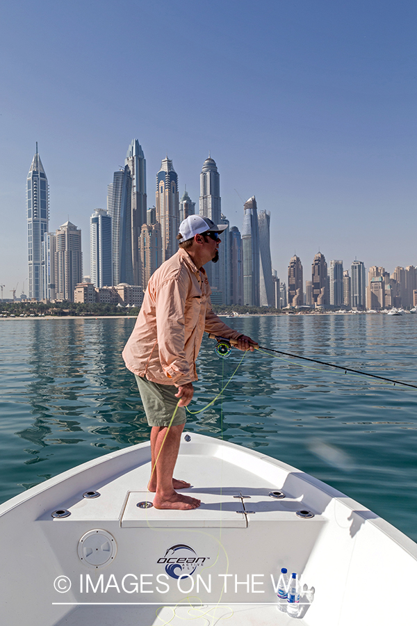 Flyfishing for queenfish off the coast of Dubai, UAE.