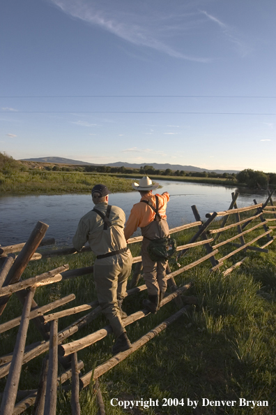 Flyfisherman scouting river.