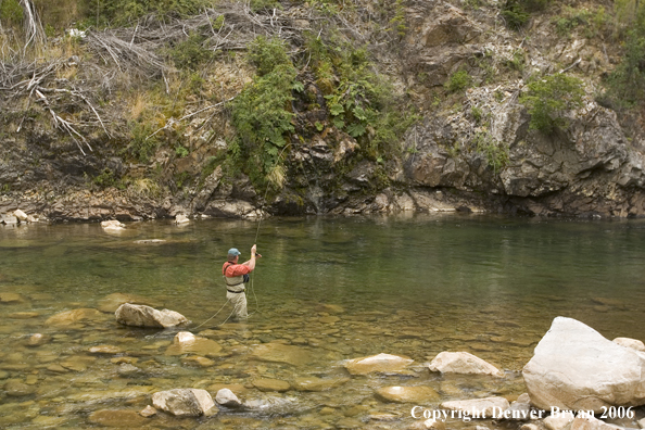 Flyfisherman with fish on.