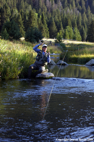 Flyfisherman fighting big fish