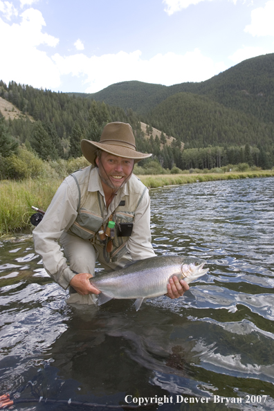 Flyfisherman with Rainbow Trout on Gallatin River, Montana