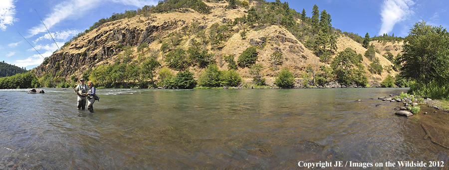 Flyfishers on river.