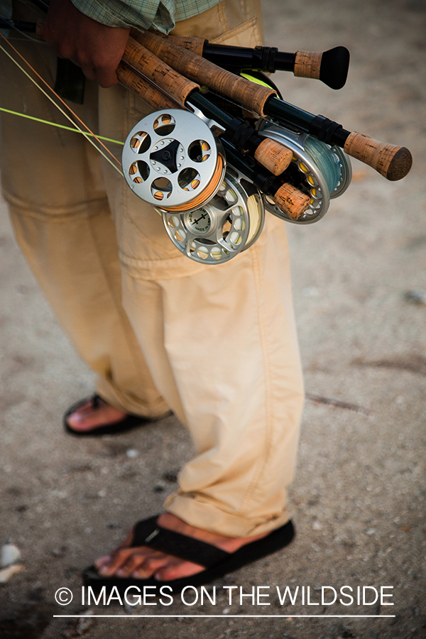 Flyfisherman with fishing rods.