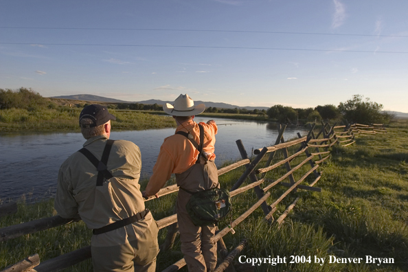 Flyfisherman scouting river.