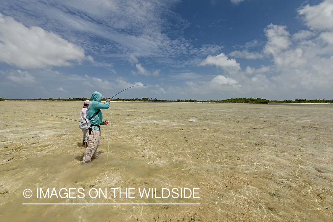 Flyfisherman and guide flyfishing for Bonefish and Permit.