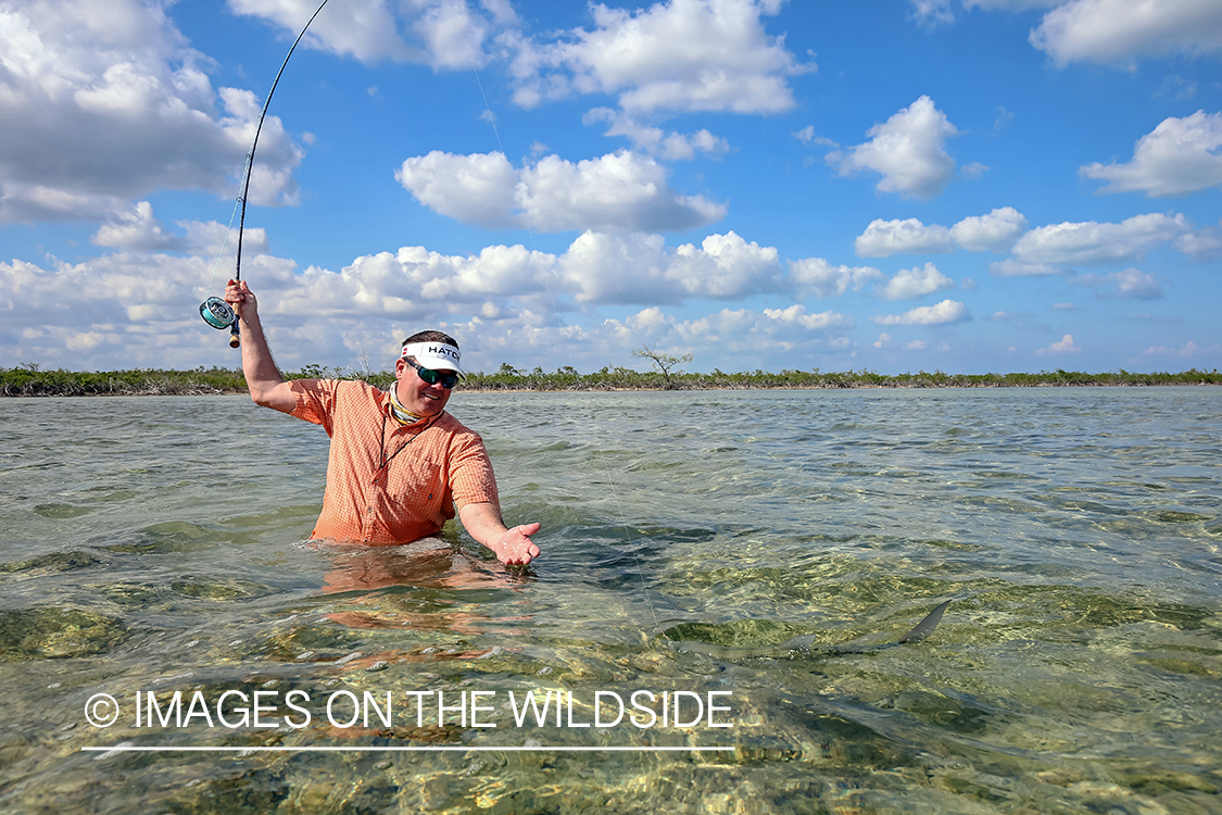 Flyfisherman fighting bonefish.