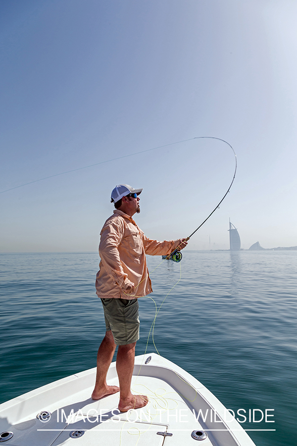 Flyfishing for queenfish off the coast of Dubai, UAE.