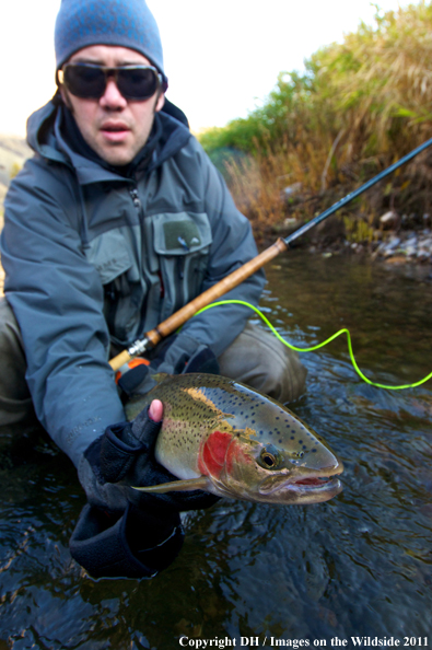 Flyfisherman with spey rod and Steelhead. 