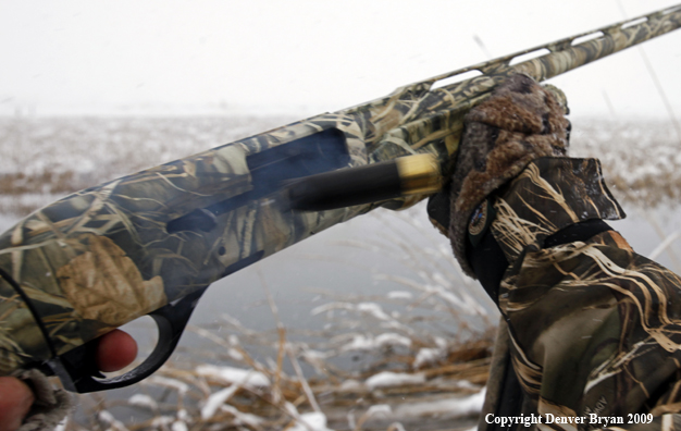 Shotgun firing shell.