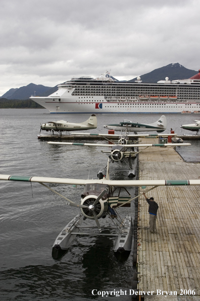 Float planes in front of a cruise ship.  (Alaska)