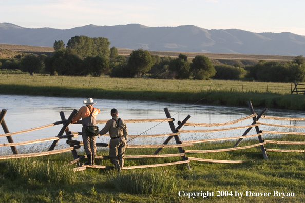 Flyfisherman scouting river.