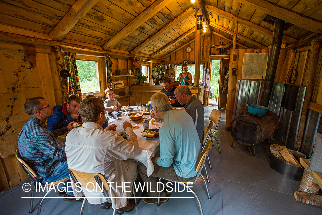 Flyfishermen with outfitter family in lodge on Nakina River.