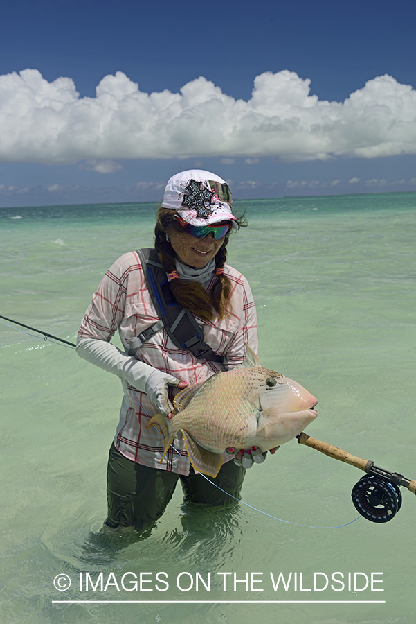 Woman with Peachy Triggerfish.