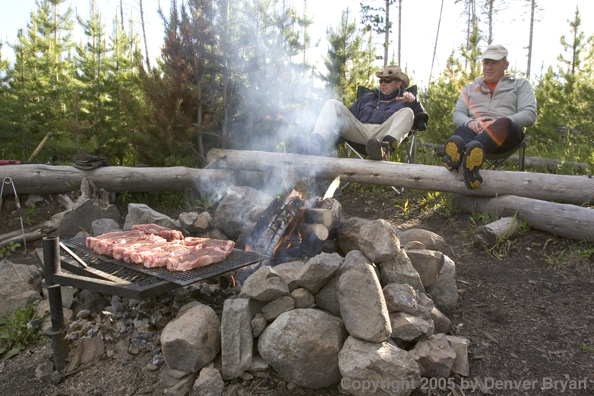 Flyfishermen at lakeside fishing camp.